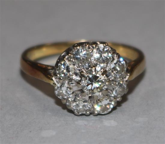 A diamond cluster ring, 18ct yellow gold shank, size K.
